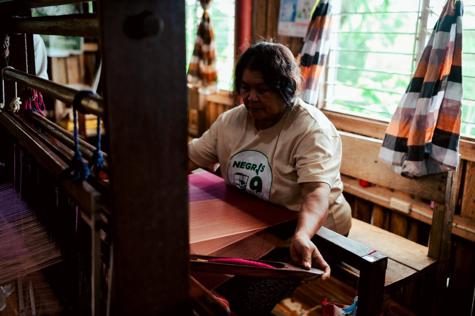 A Negros Nine weaver at her loom