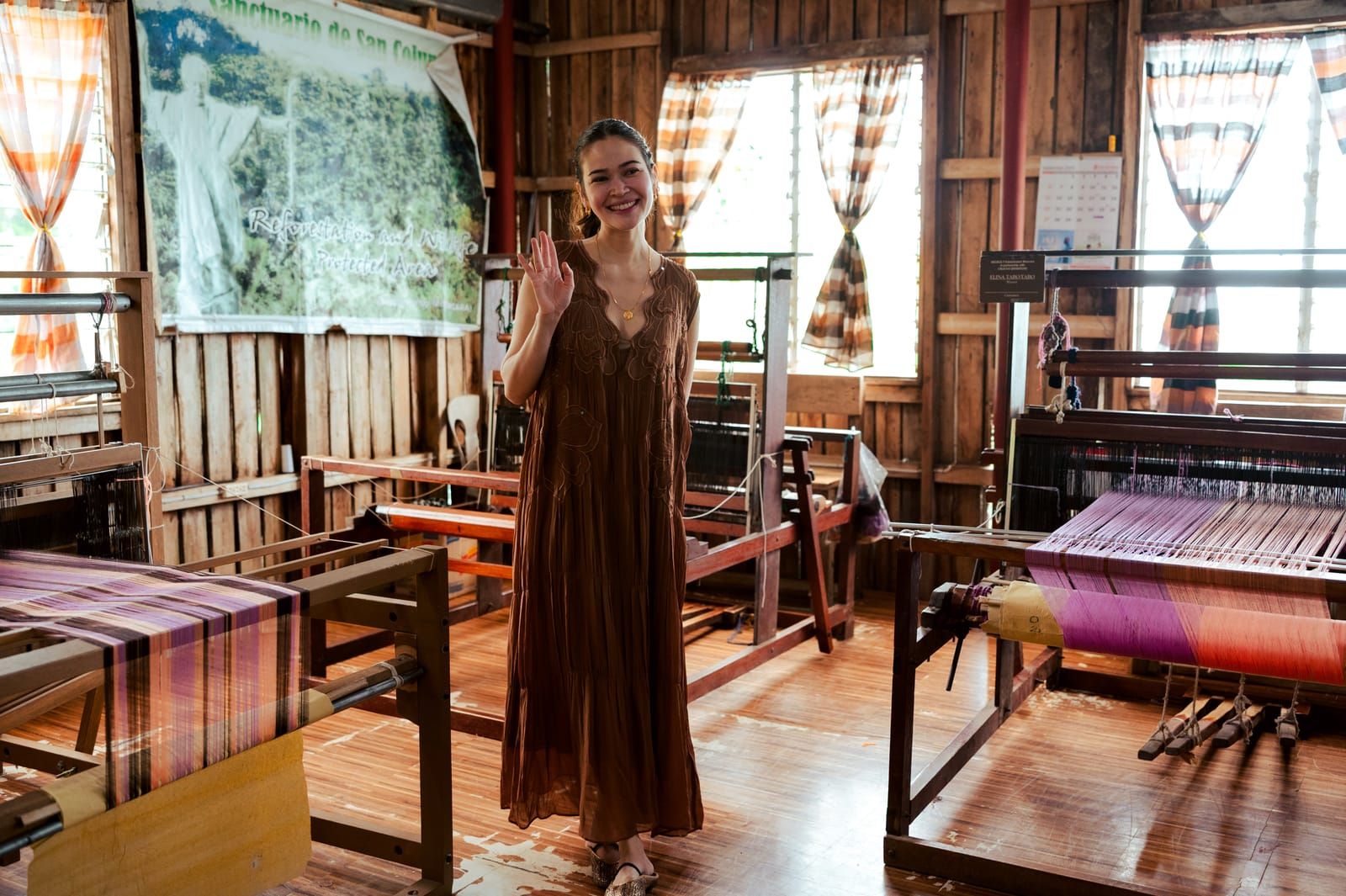Bela Padilla waving inside the weaving centre