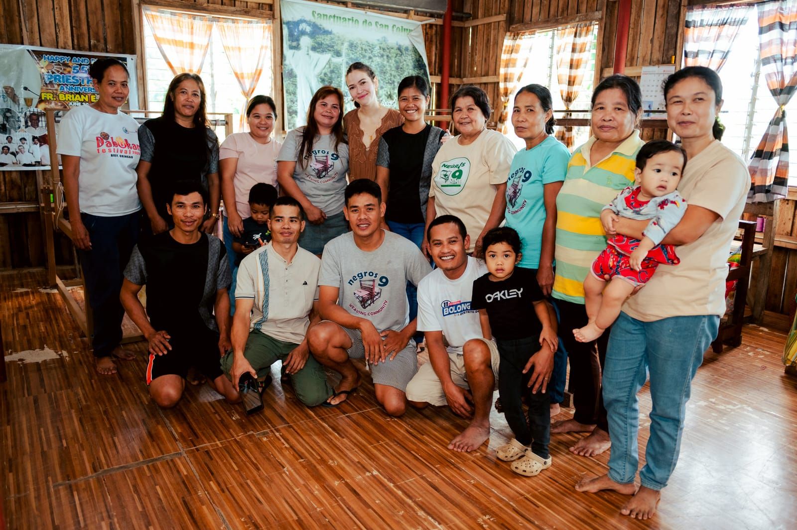 Bela Padilla with the Negros Nine Weavers and their families