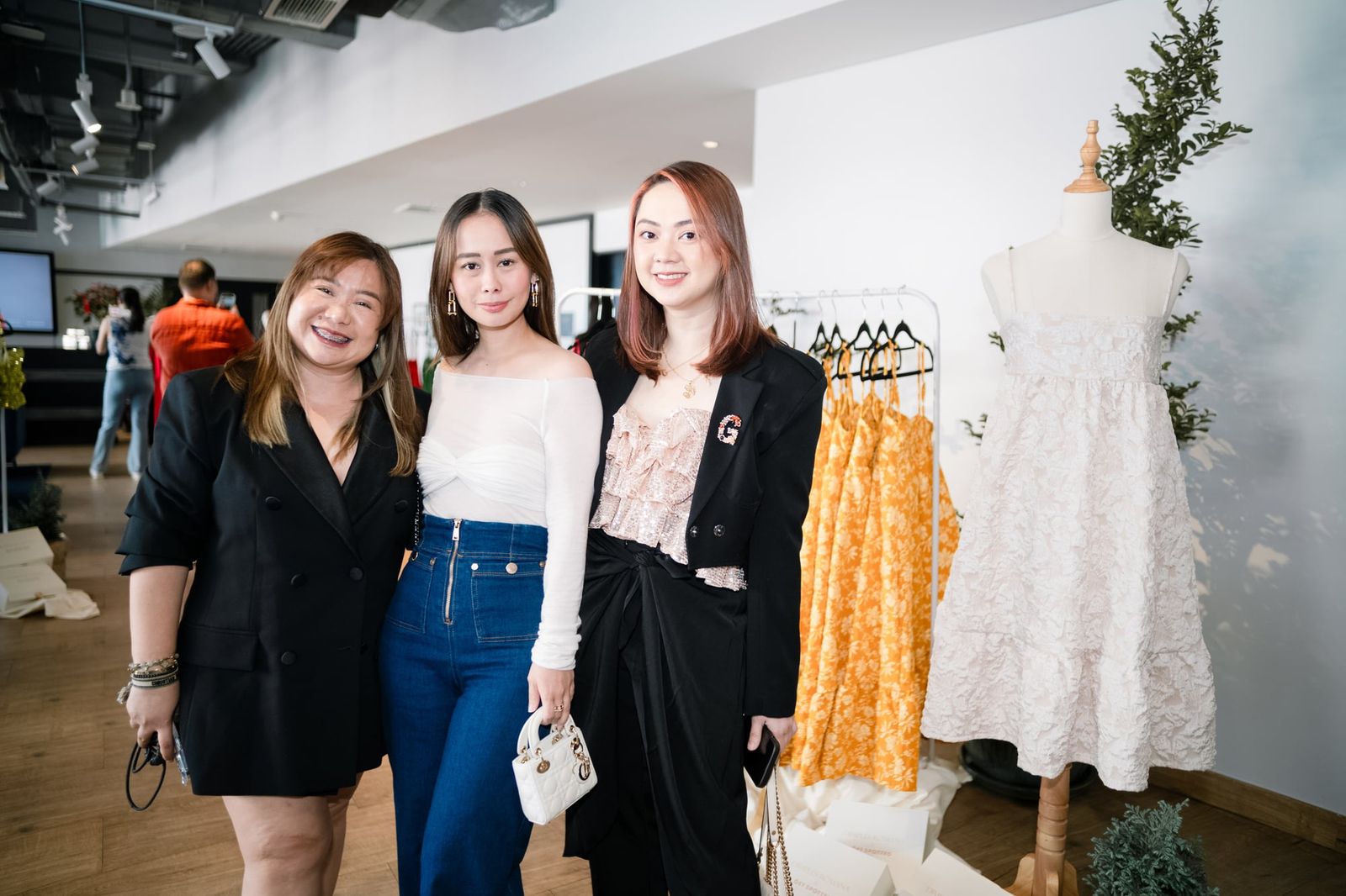 Guests posing beside the collection