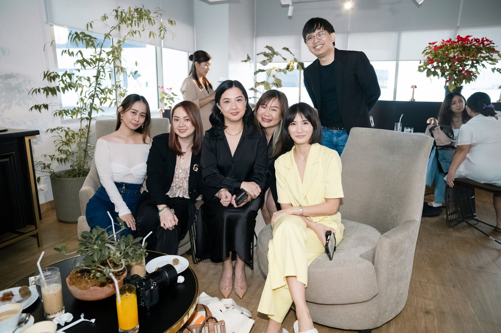 Guests gathered on the sofa at the launch