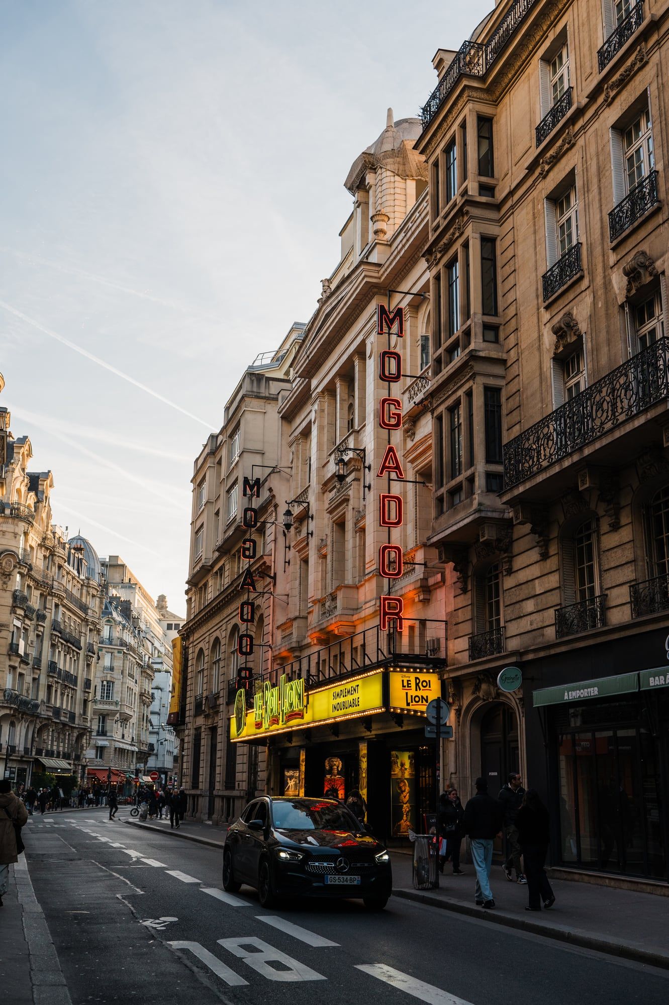 A Paris street lined with classic Haussmann buildings