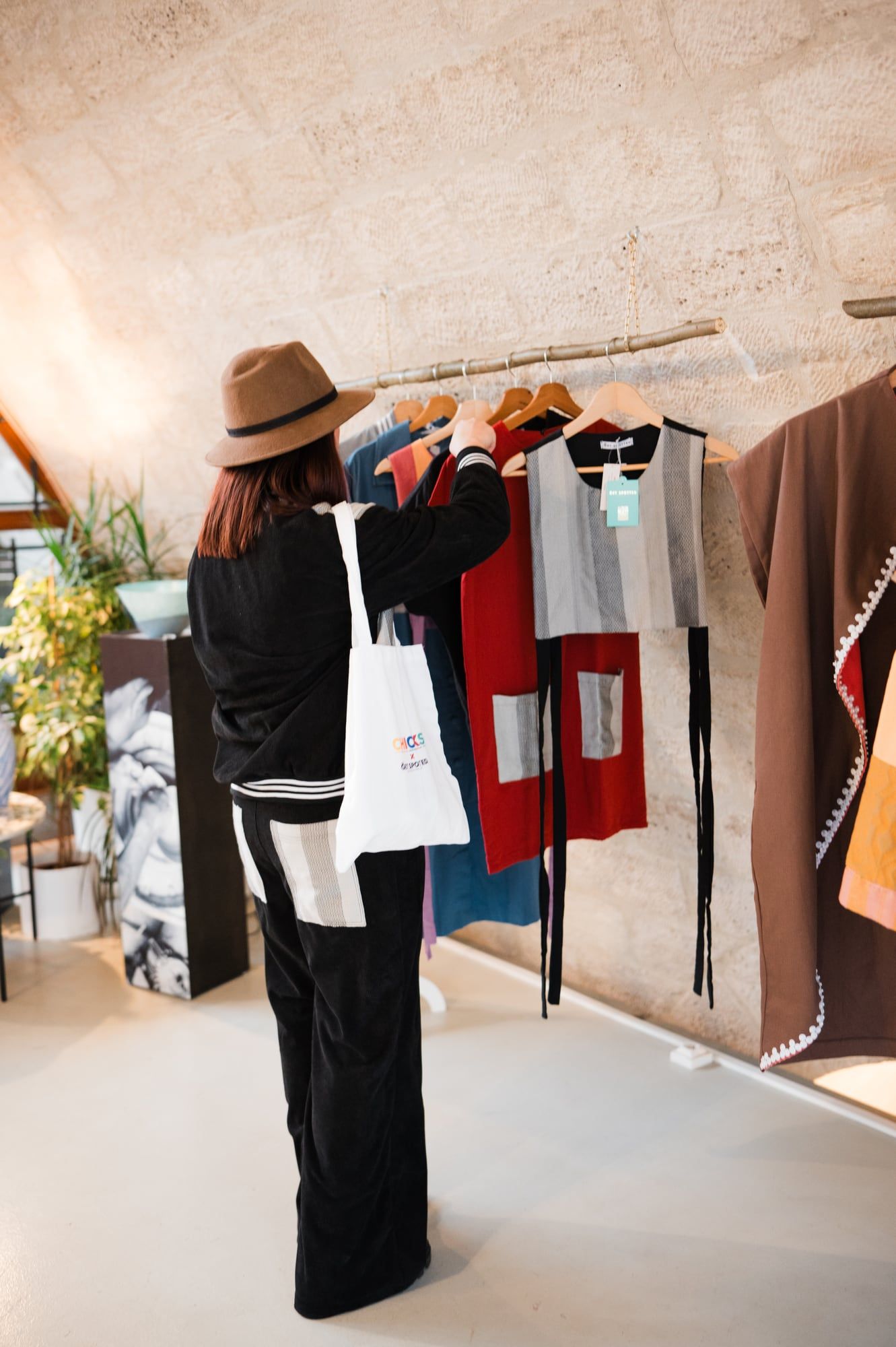 Emgee browsing the rail: the CHICKS x Get Spotted pants with the standout striped back pocket