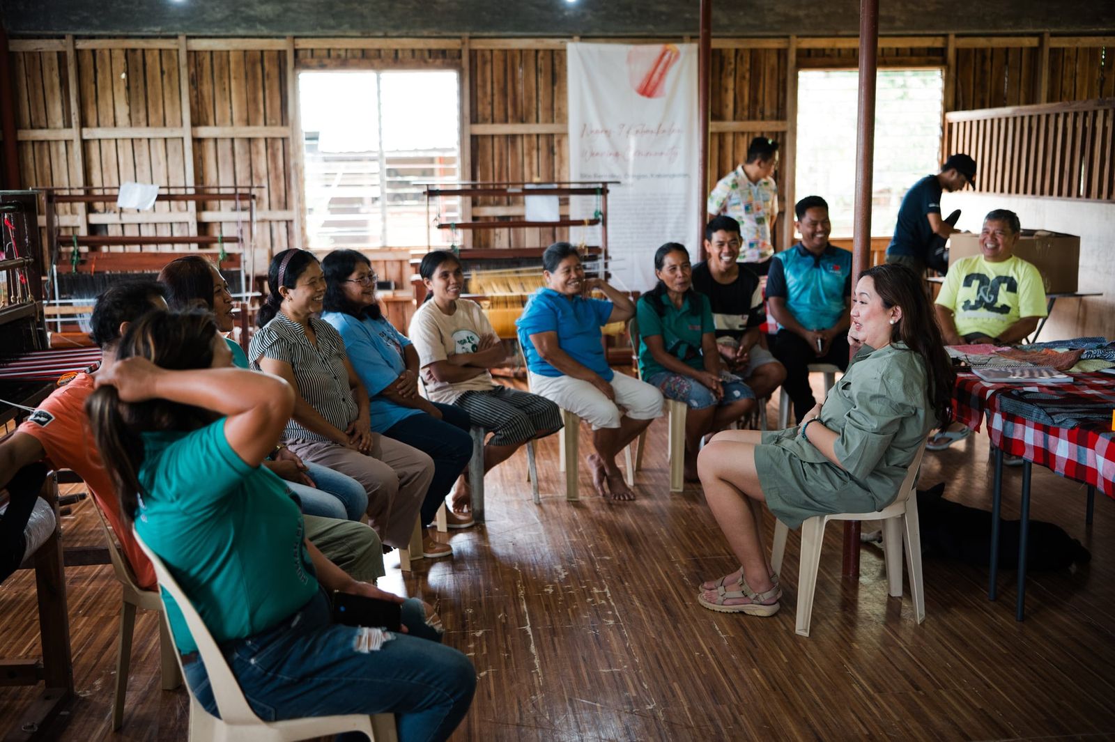 The weavers and visitors gathered for a talk at the weaving centre