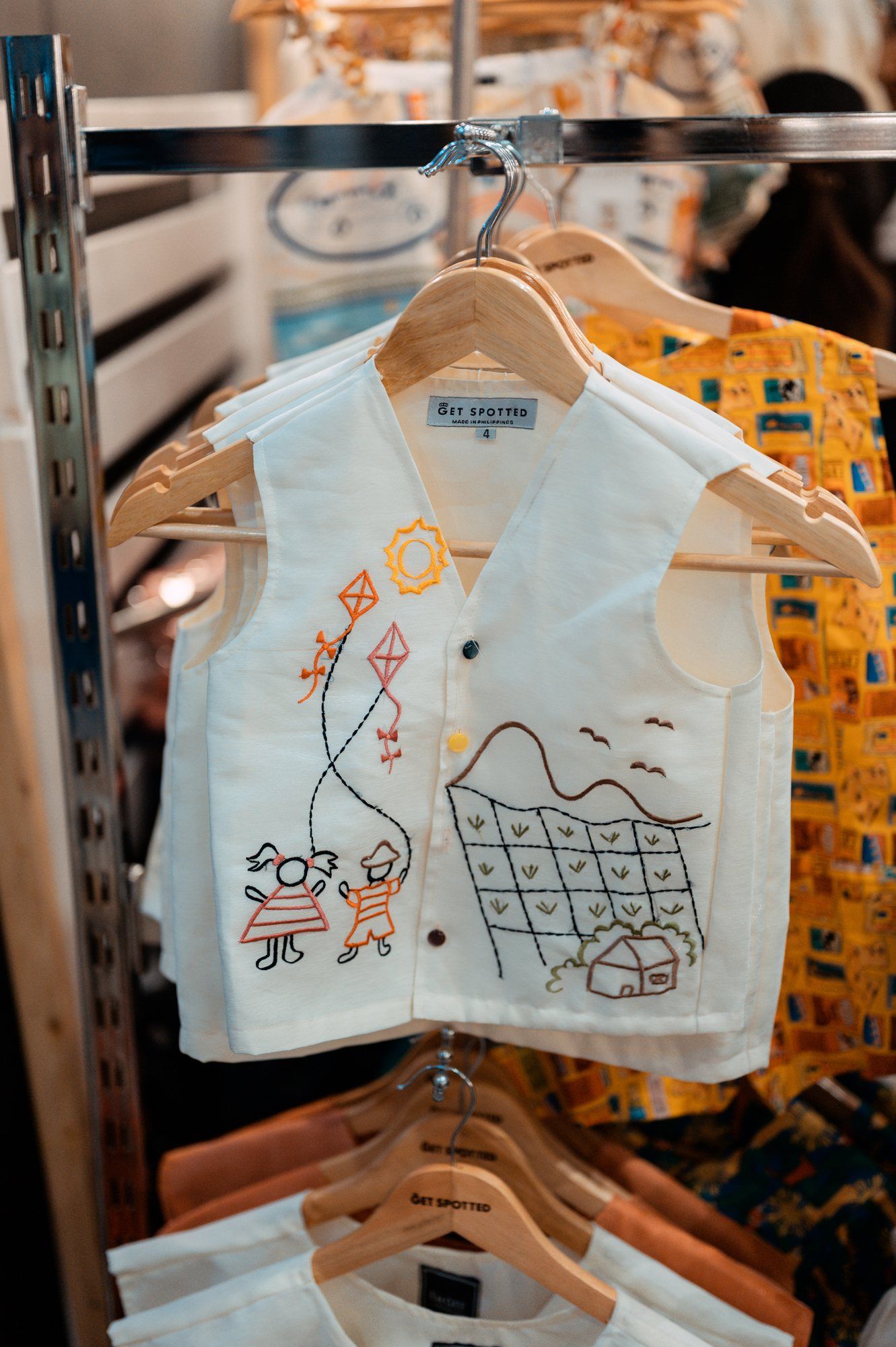 EMGEE by Get Spotted white vest with hand-drawn embroidery