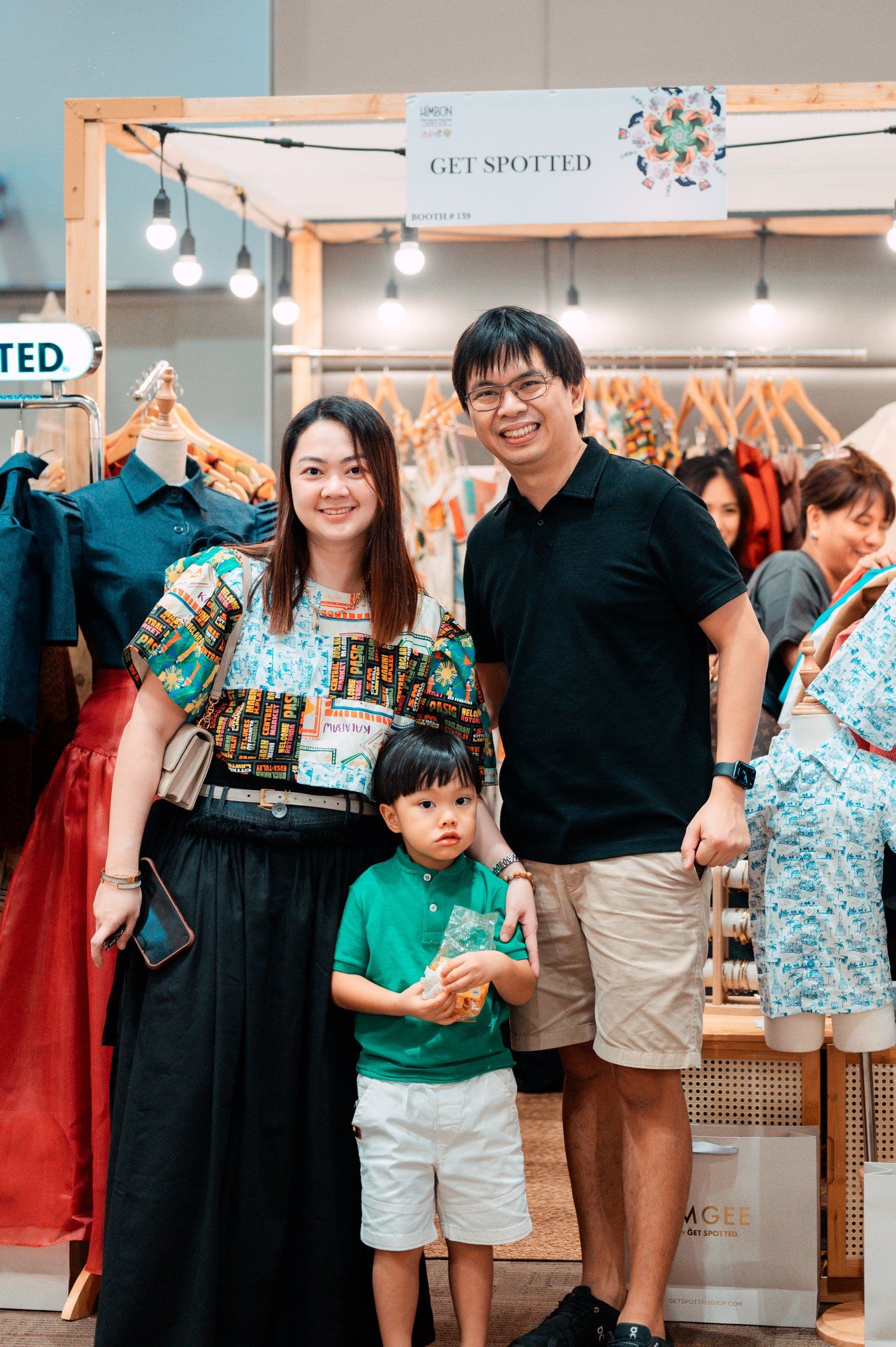 Family photo in front of the Get Spotted booth at Himbon