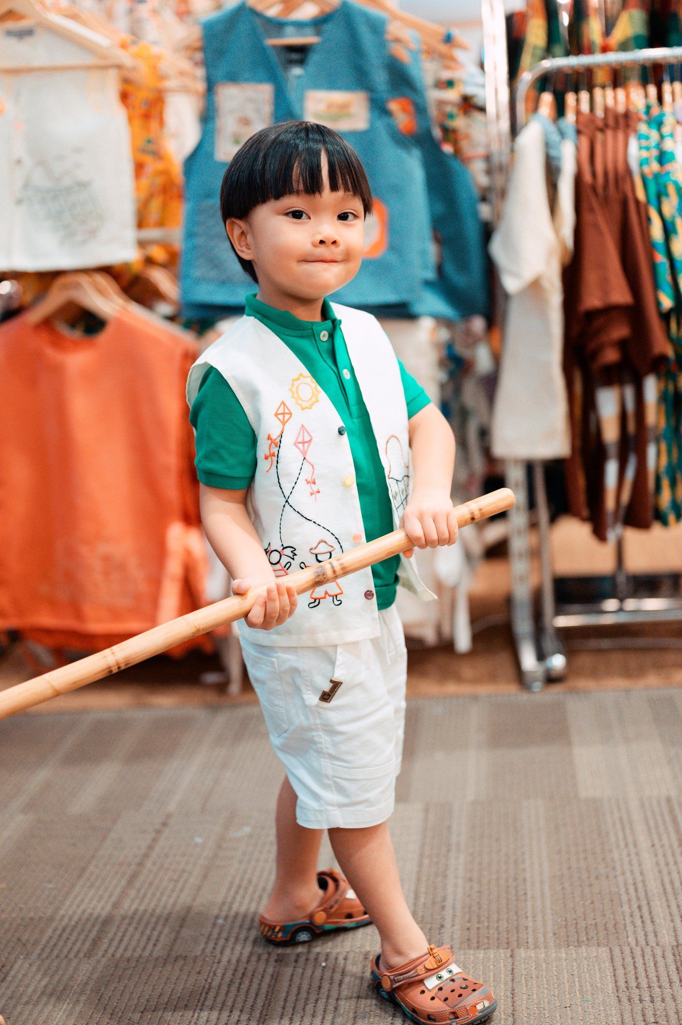 A little boy in an embroidered vest at our Himbon booth