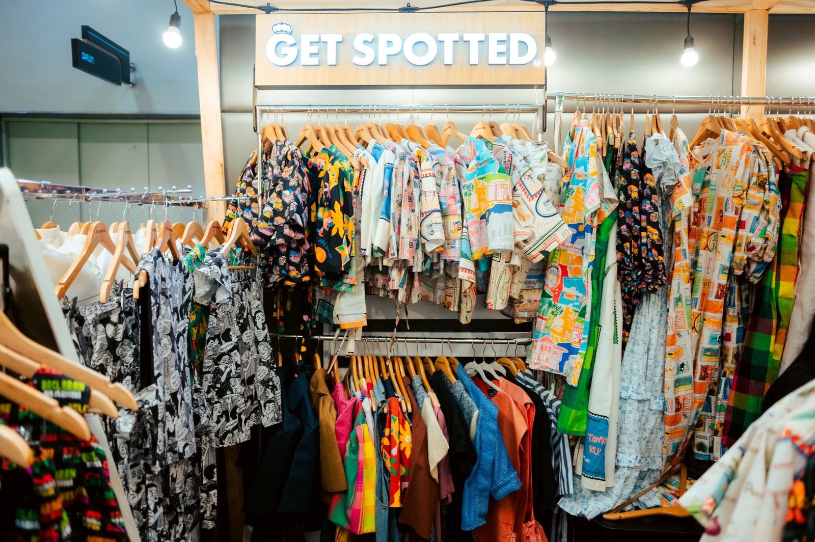 The Get Spotted booth at the Negros Trade Fair, racks full of prints
